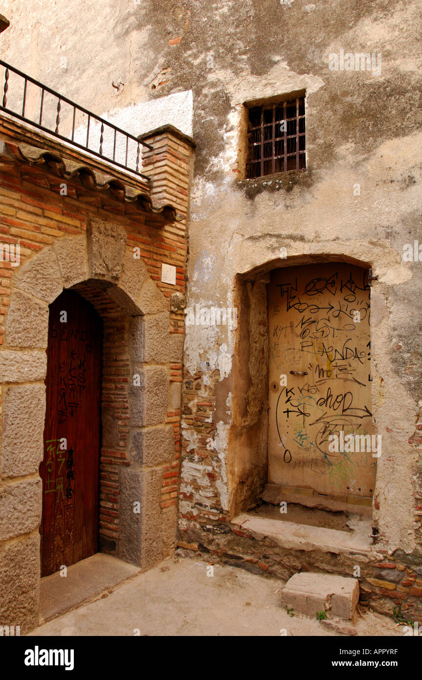 old walls doors and windows shutters and blinds in a rustic style Spanish ramshackle old historic architecture Stock Photo