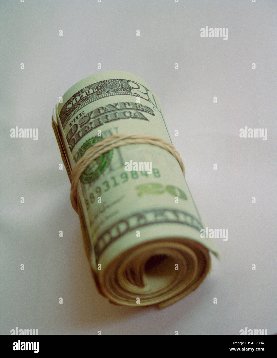 Roll of 20 Dollar bills Stock Photo