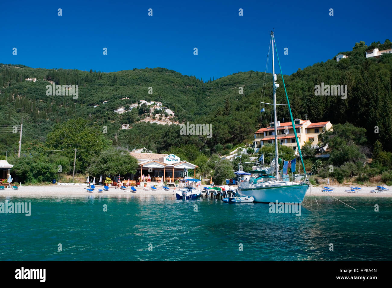 Yacht moored at Taverna Agni, Agni Bay, Corfu, Greece Stock Photo - Alamy