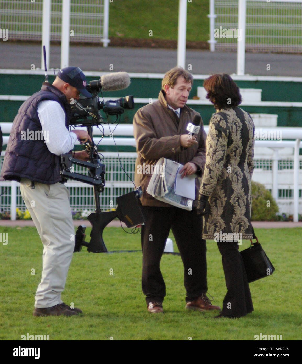 Steadicam operator in action for interview at Sandown Park for Channel 4 TV Stock Photo