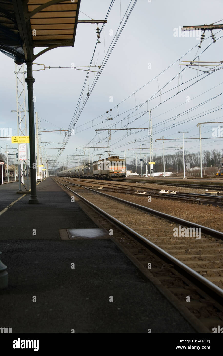 Image of a freight train passing through the French railway station at La Souterraine in the Image of a freight train passing through the French railway station at La Souterraine in the