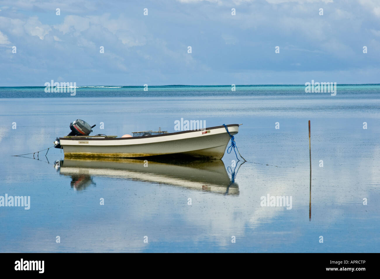 Small Motorboat and Reflection Yap Island Stock Photo