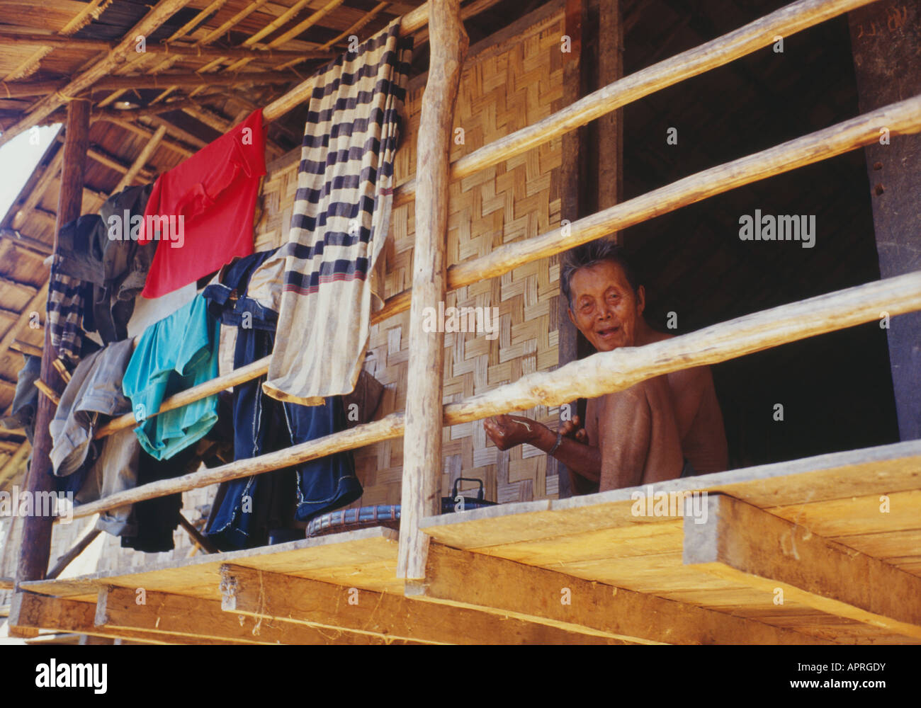 old lady sitting on balcony of house Stock Photo - Alamy