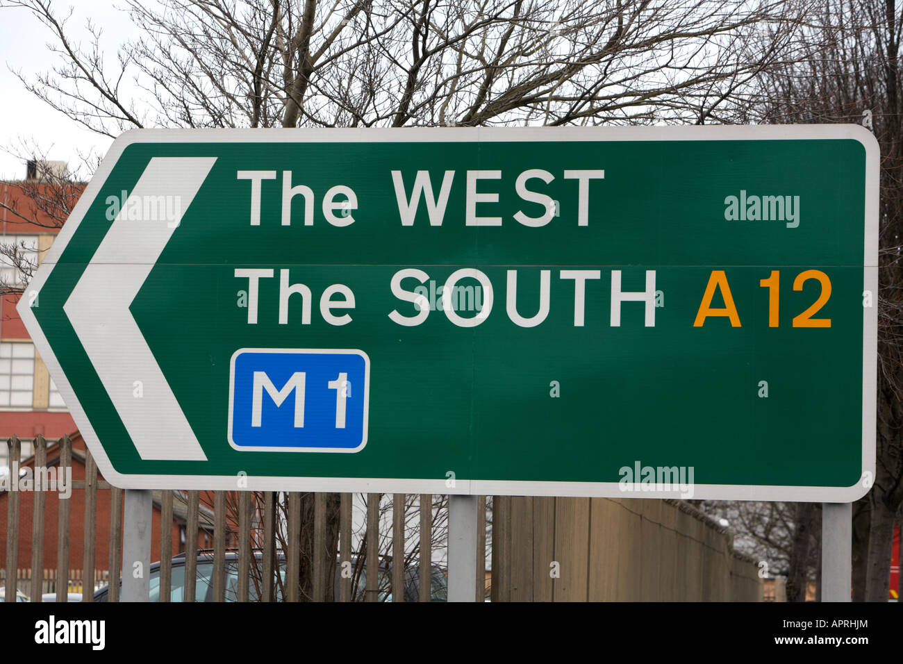 traffic sign on the westlink in central Belfast showing directions to the west the south via A12 M1 motorway Northern Ireland Stock Photo