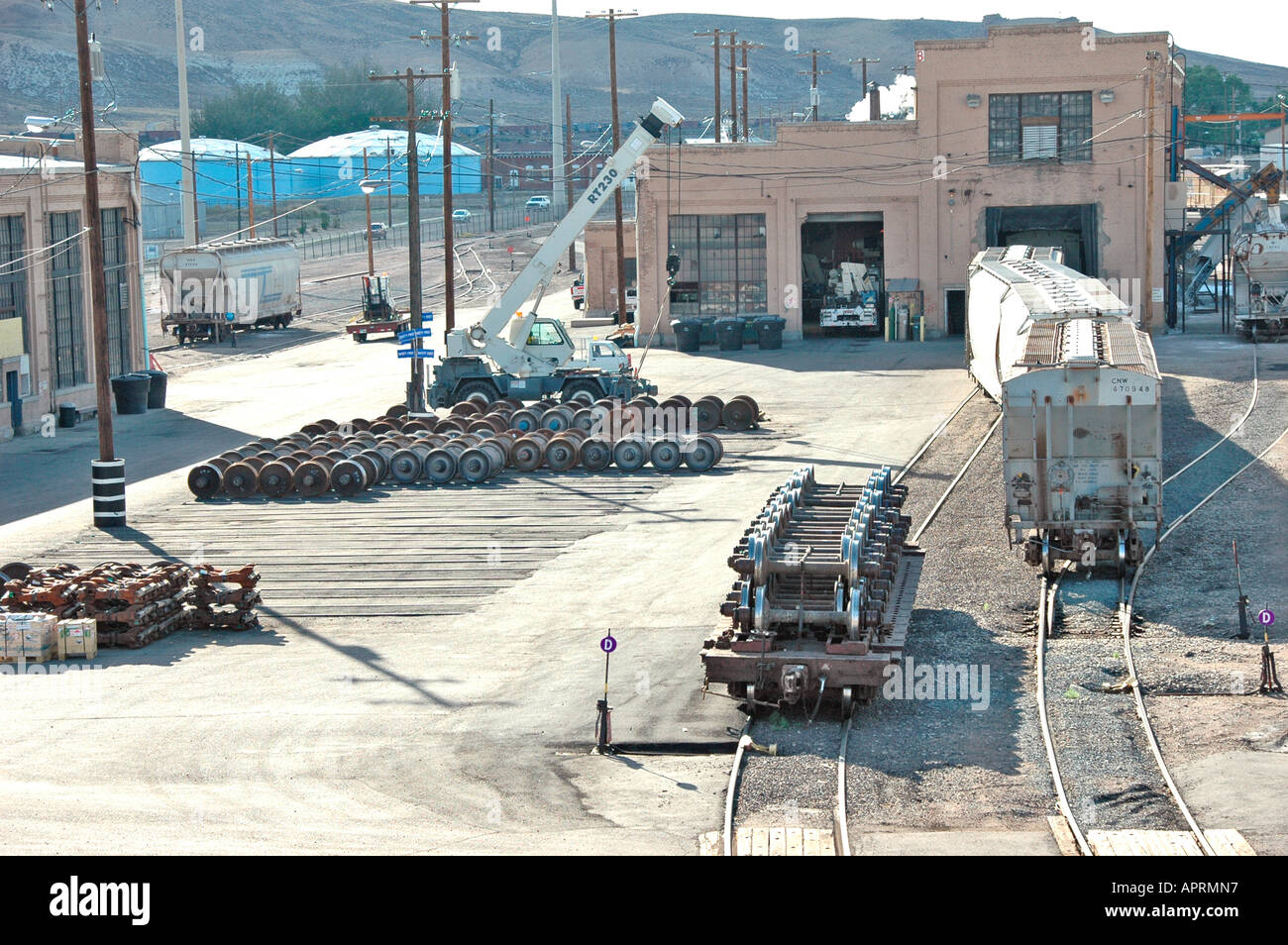 Railroad train switching yard with sidings and switchers and engines