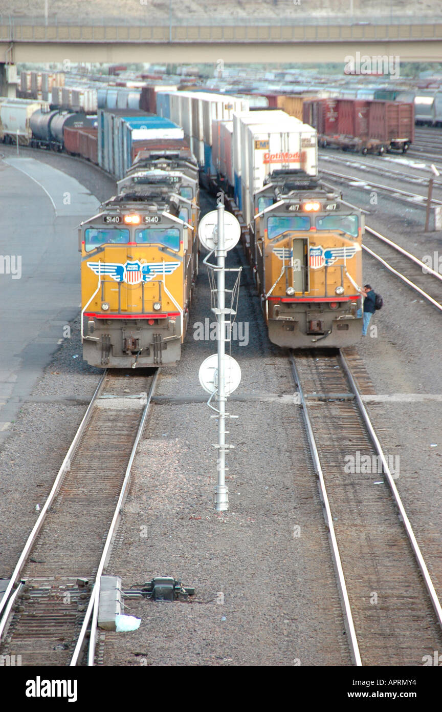 Railroad train switching yard with sidings and switchers and engines