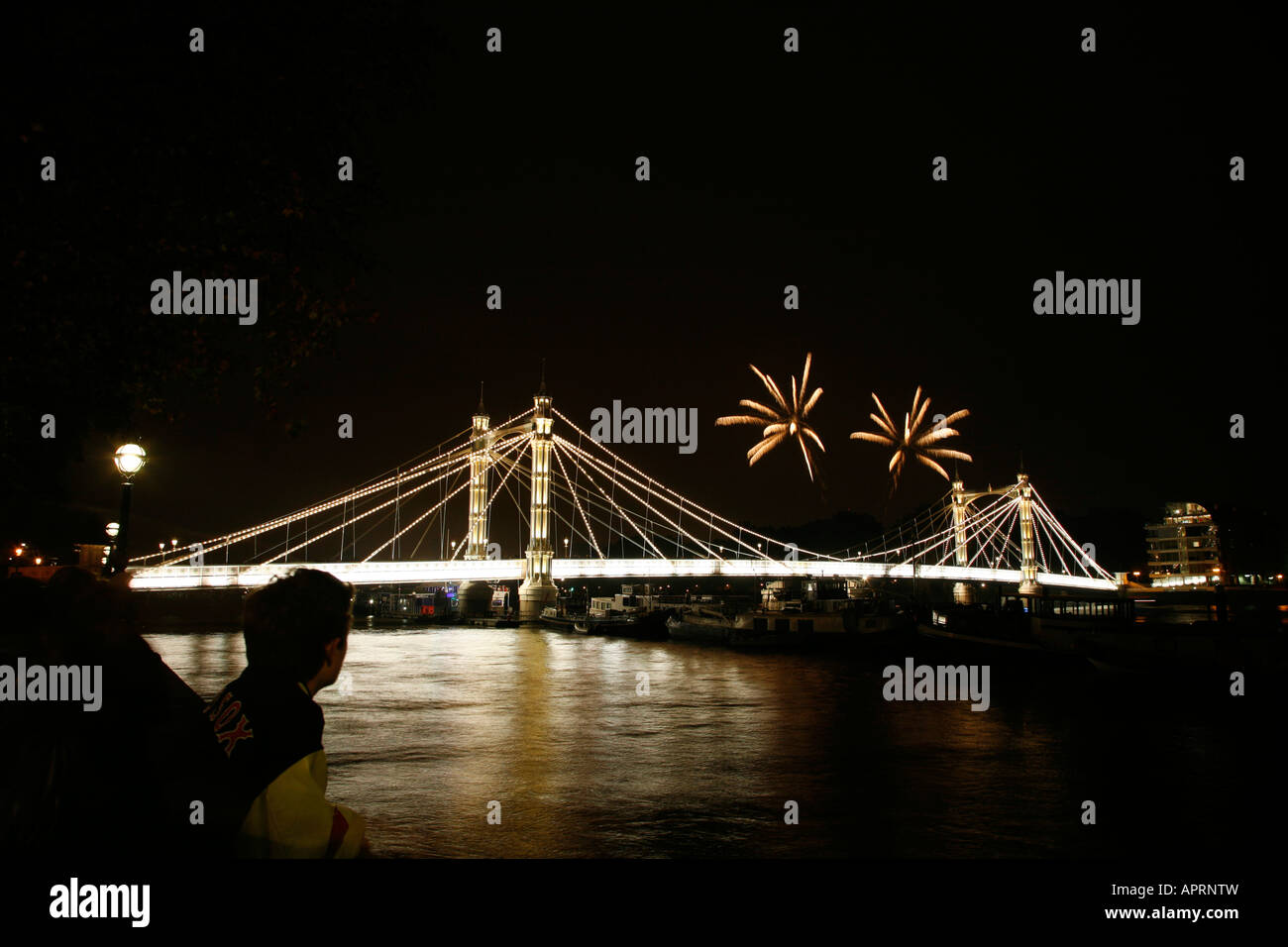 Battersea Park fireworks seen from Albert Bridge in Chelsea, London Stock Photo