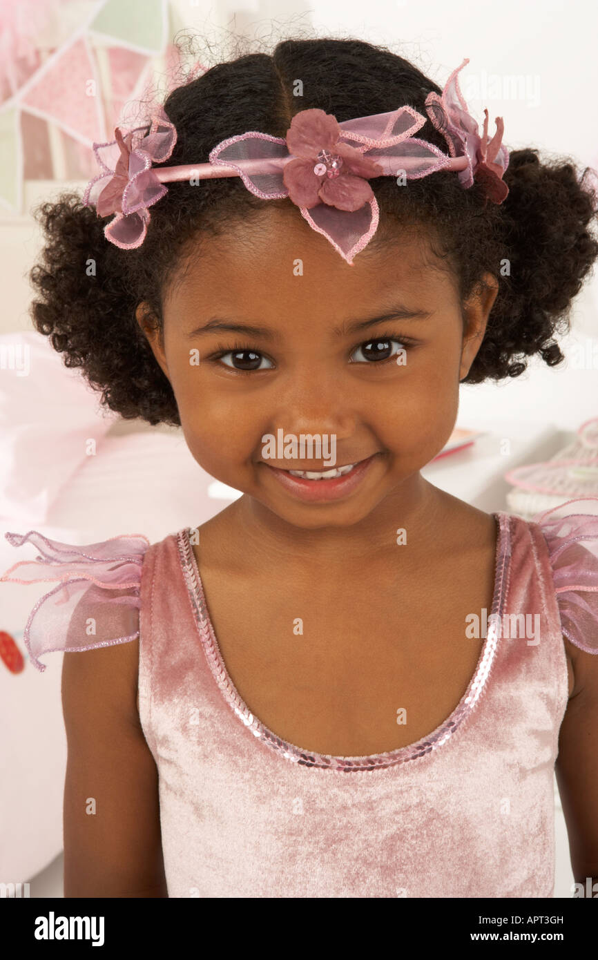 a girl plays dressing up in her bedroom, she is dressed as a princess ...