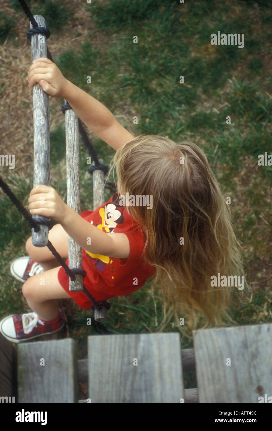Little Girl climbing a Rope Ladder Stock Photo Alamy