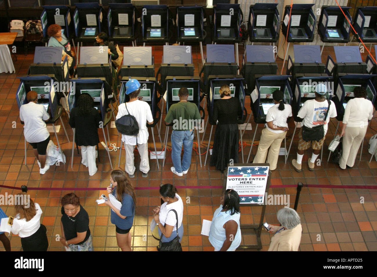 Miami Florida,Stephen P. Clark Government Center presidential election early,touch screen voting machines booths voters Black men male female women Stock Photo
