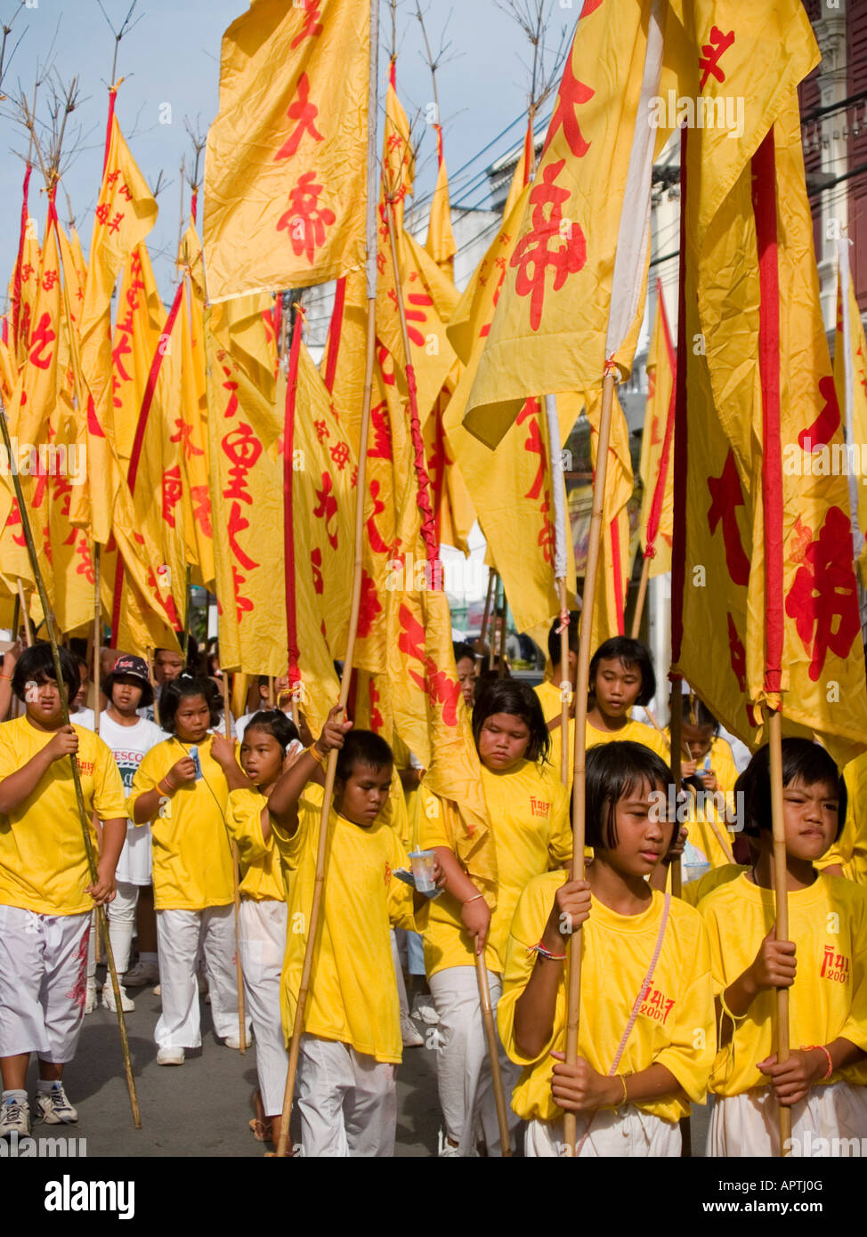 Red and yellow ceremonial flags hanging outside a Chinese shrine in Phuket Town during the Vegetarian Festival