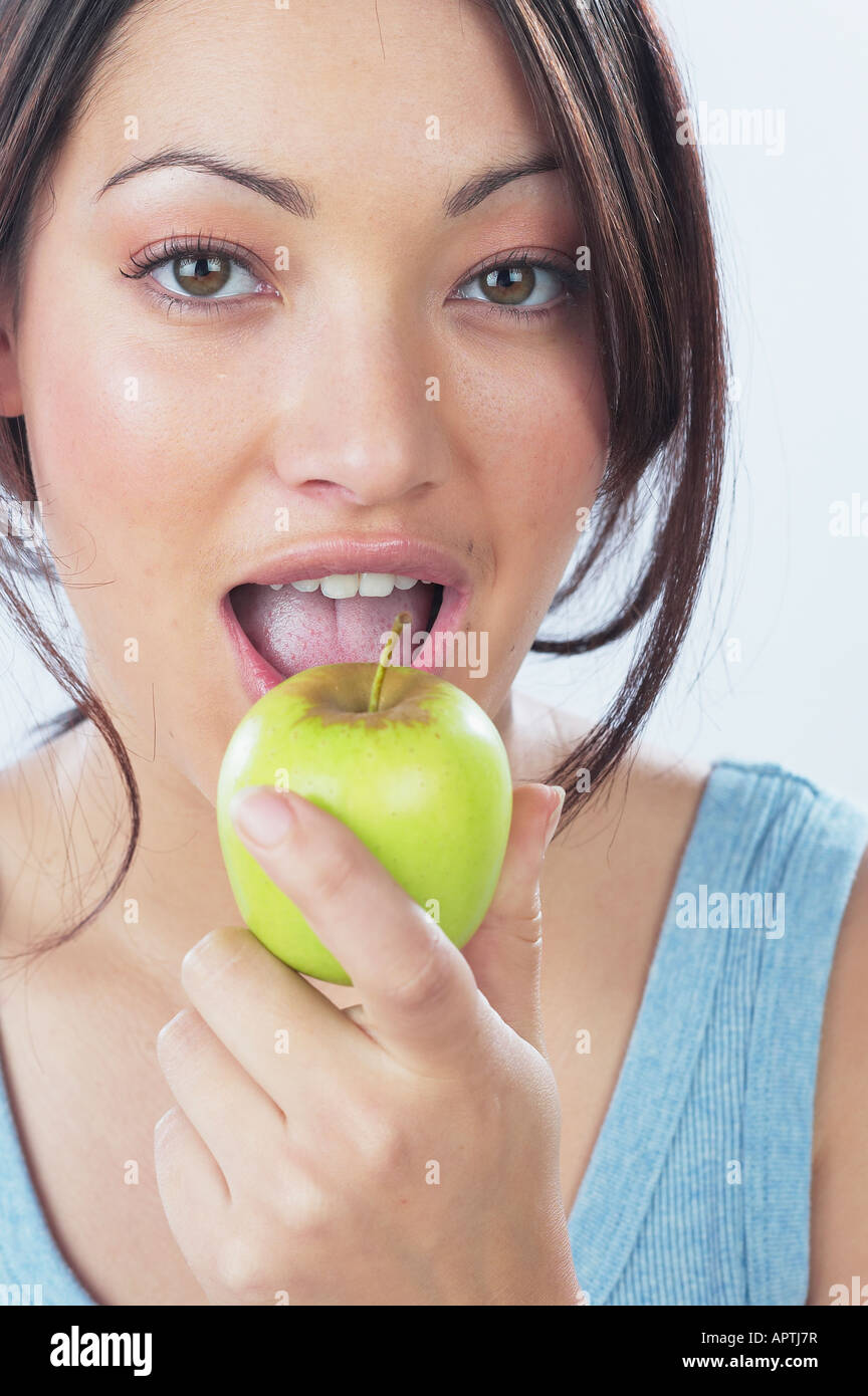 Young woman eating apple Stock Photo Alamy