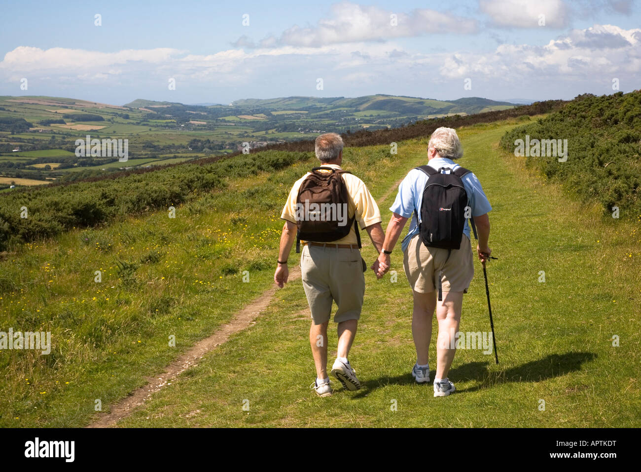 Retired couple walking along Nine Barrow Down from Swanage to Corfe Castle Purbeck Dorset UK Stock Photo