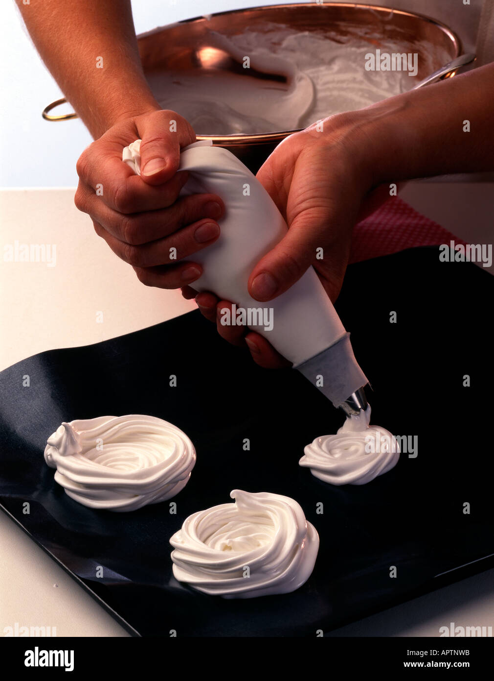 Steps to piping meringue nests with a swirling motion to make the base
