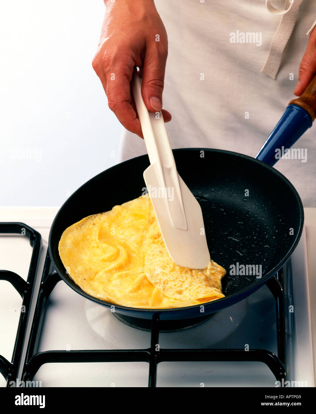 Making omelettes - folding over plain omelette using a large