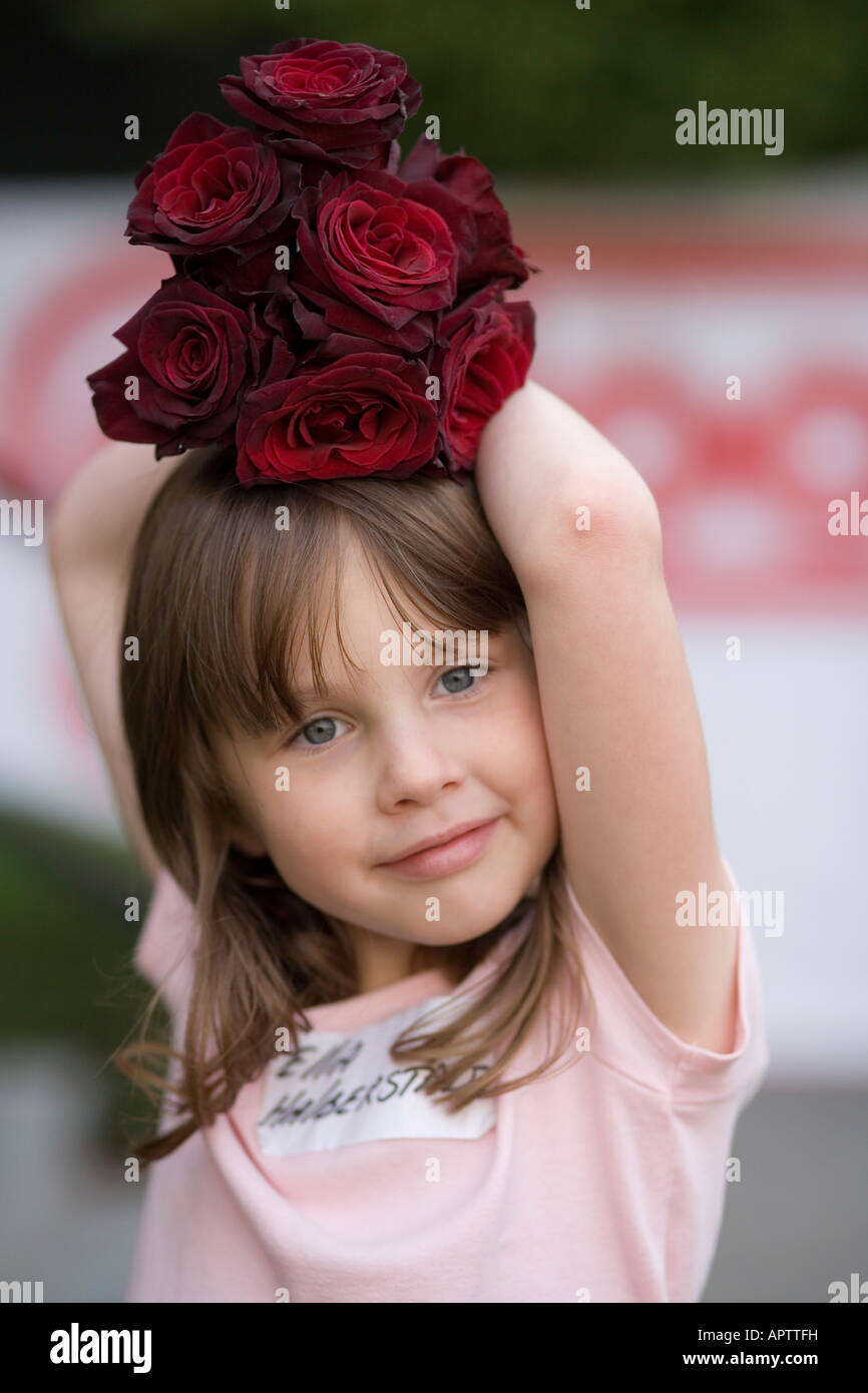 Girl with roses on her head Stock Photo Alamy