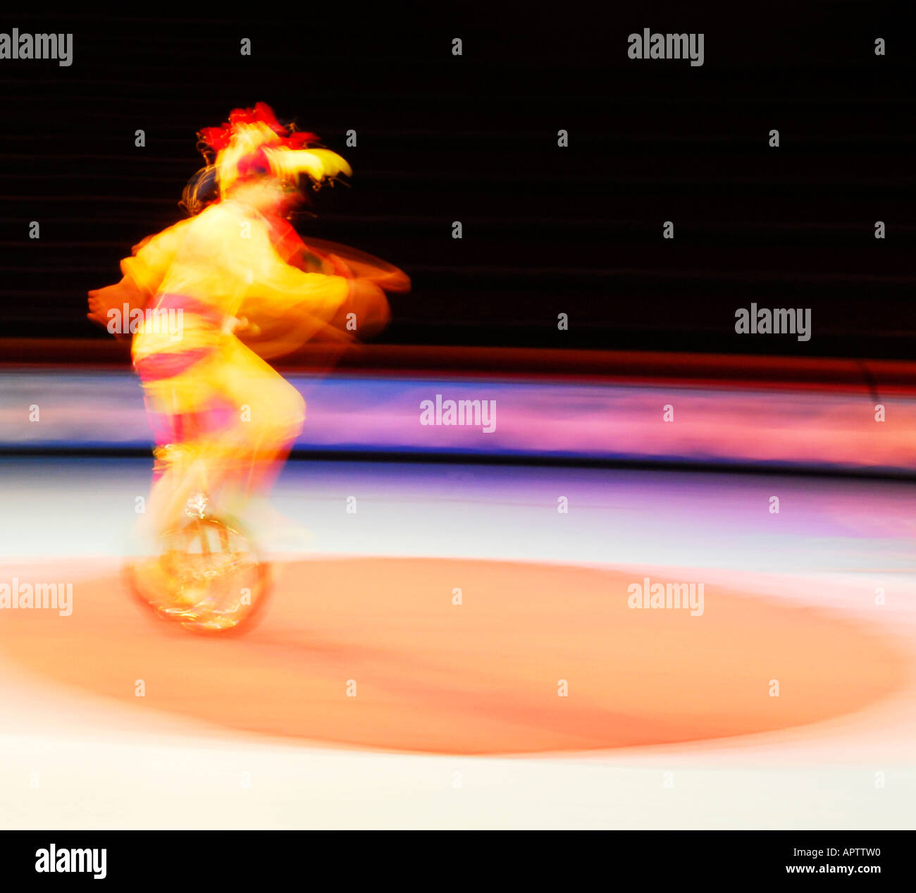 Circus juggler on unicycle performing in the ring Stock Photo Alamy