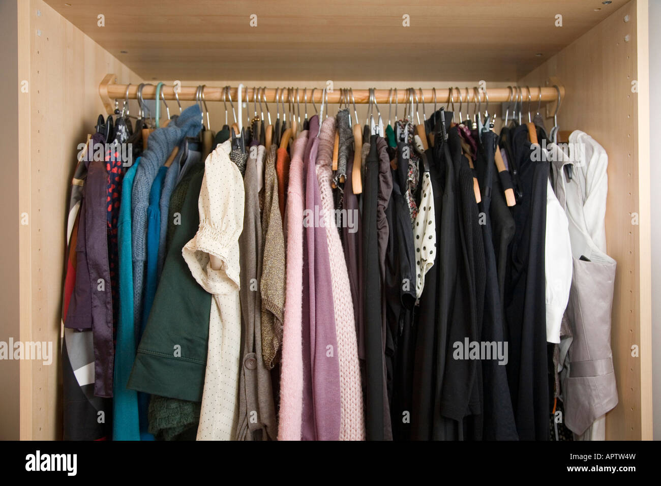 Clothes rail in womans closet,wardrobe Stock Photo