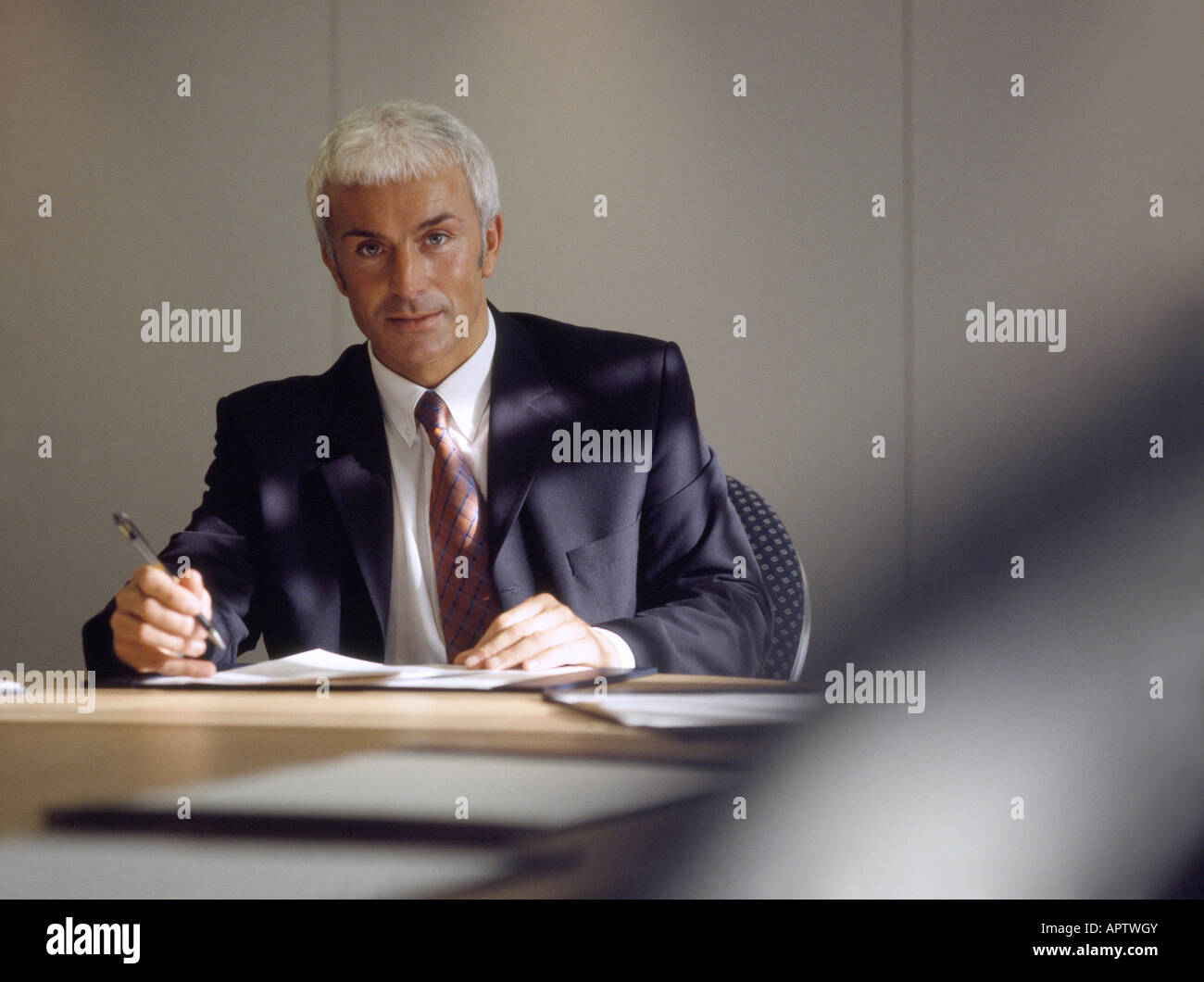 Manager in Boardroom Stock Photo
