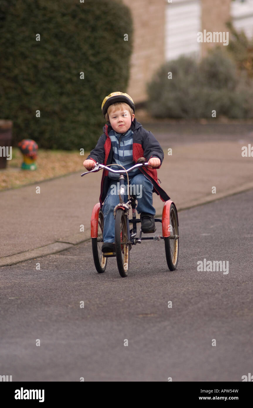 boy on tricycle