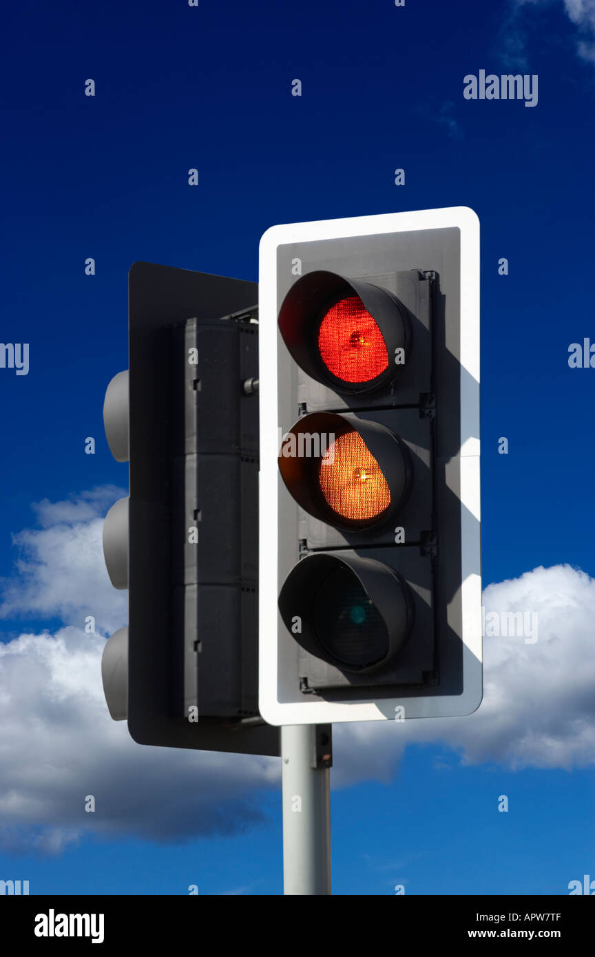 ROAD TRAFFIC LIGHT WITH BLUE SKY Stock Photo