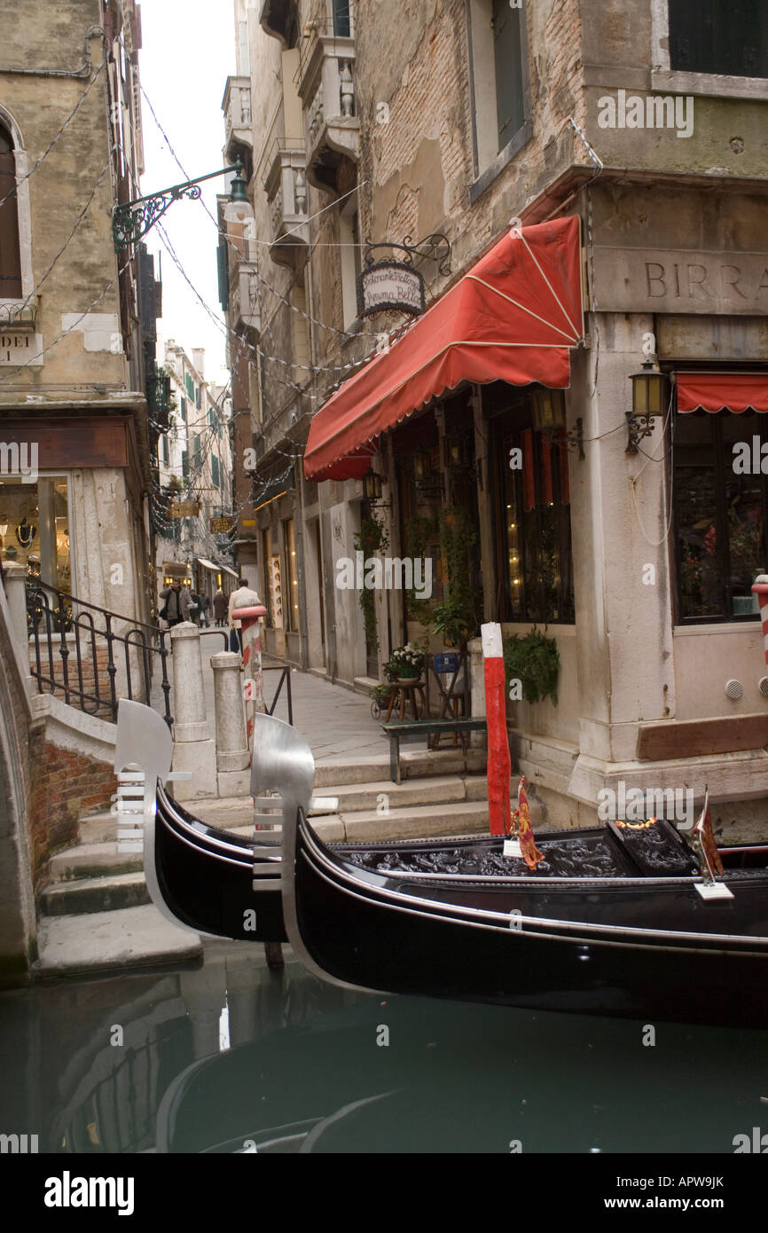 Gondolas tied up in venice canal hi-res stock photography and images ...