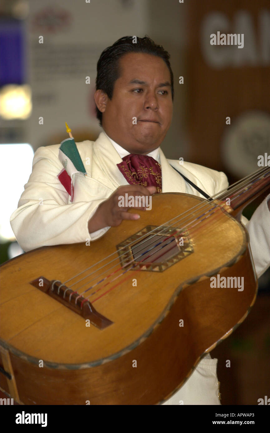 Mariachi plays acoustic bass guitar Cancun Mexico Stock Photo - Alamy