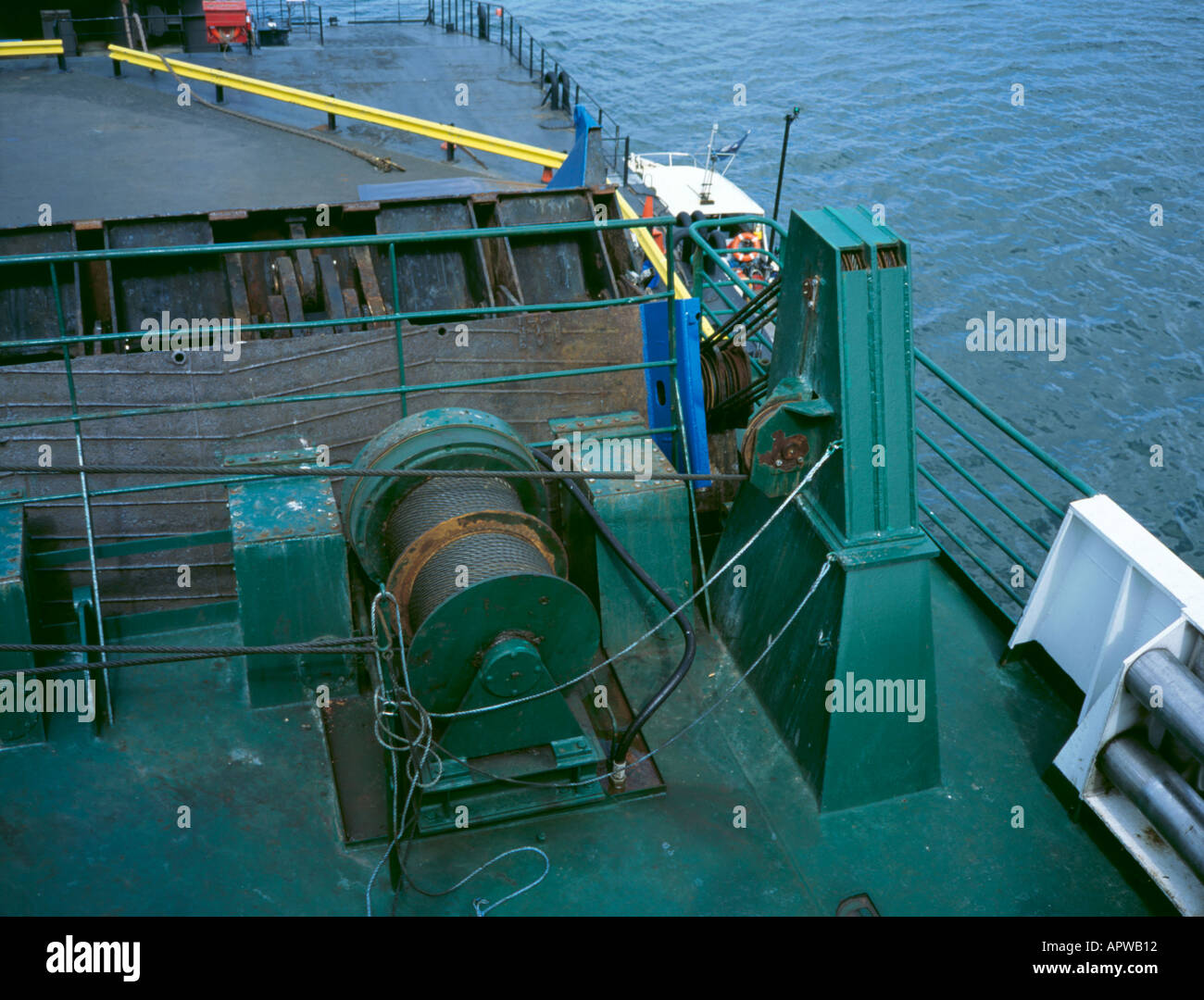 Power winch and steel cables being used to raise a ramp on a car ferry