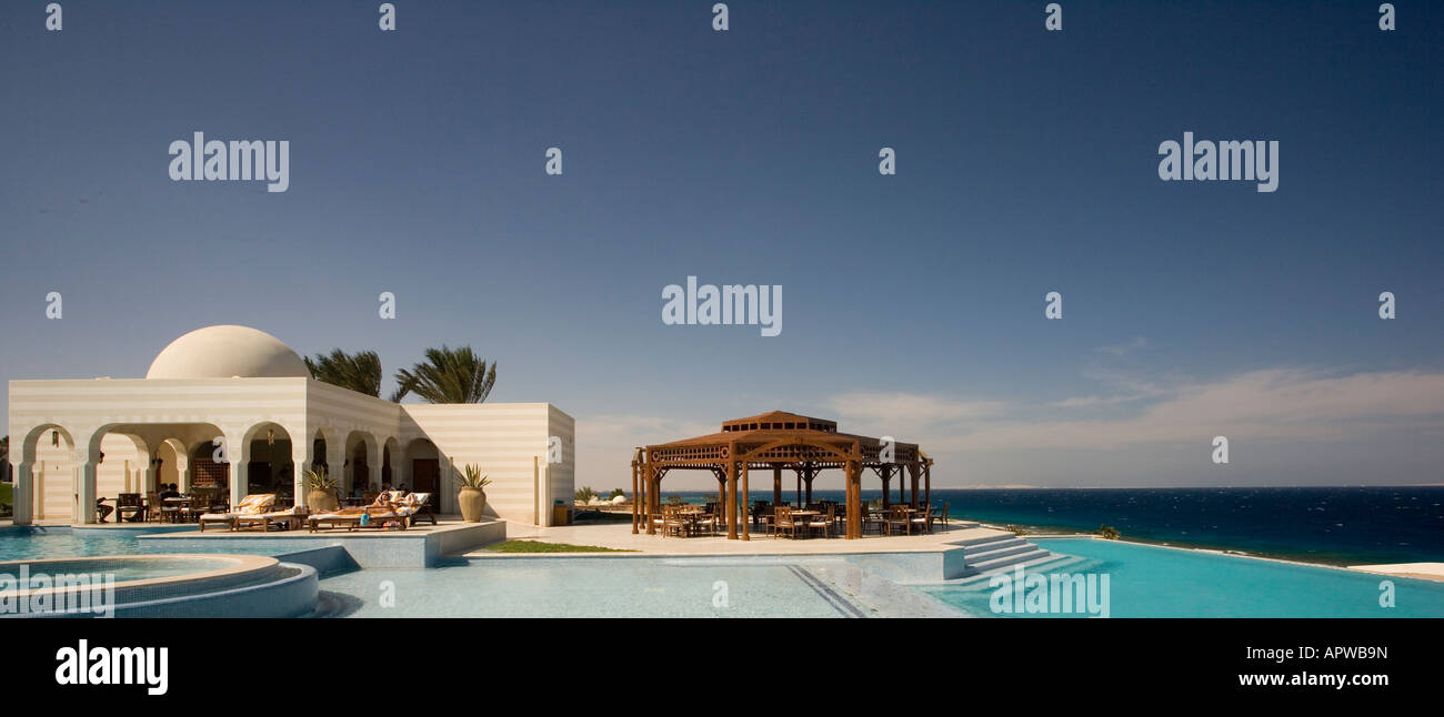 Egypt, Sahl Hasheesh, Swimming pool at the Oberoi hotel with red sea in ...