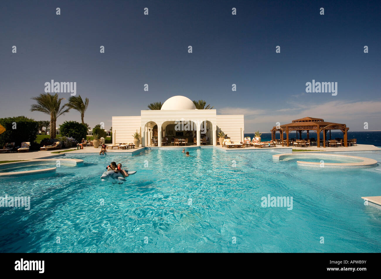 Egypt, Sahl Hasheesh, Swimming pool at the Oberoi hotel with red sea in ...