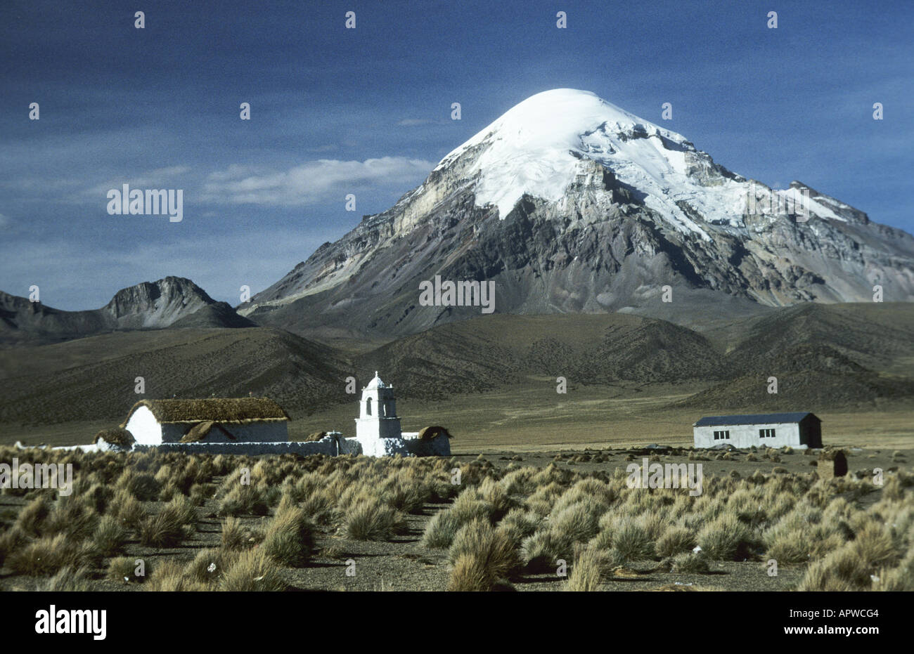 Church tower of Lagunas in front of the the Nevado Sajama.Parque Nacional Sajama, Bolivia. Stock Photo