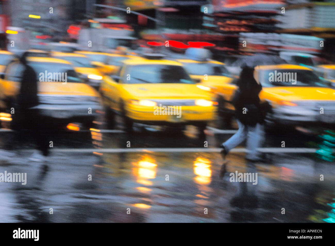 New York City rain. People crossing the wet street on a rainy day on
