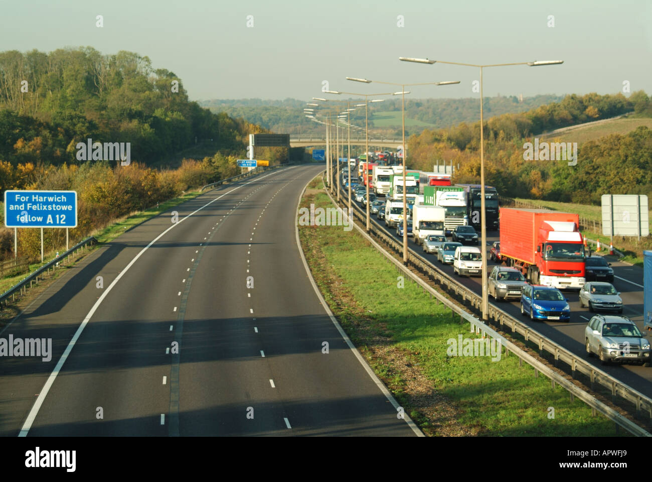 Deserted m25 motorway closed to traffic because of an accident with traffic slow in the opposite direction due to rubber necking Stock Photo