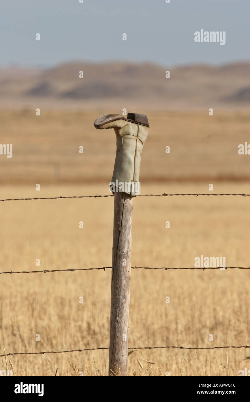 An old cowboy boot on a fence post in scenic Southern Saskatchewan