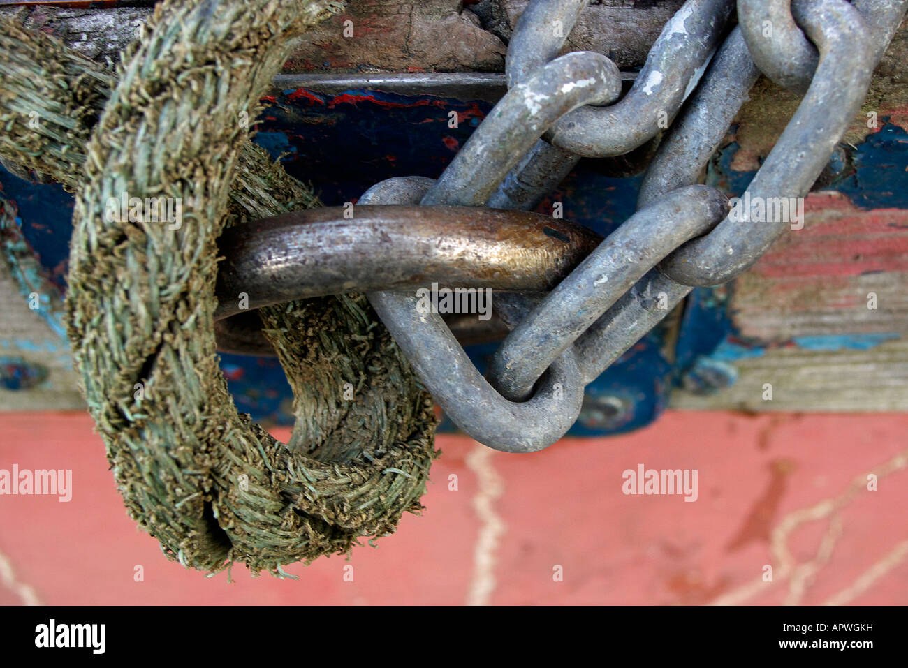 detail of a wooden small craft tied with rope and chain Stock Photo