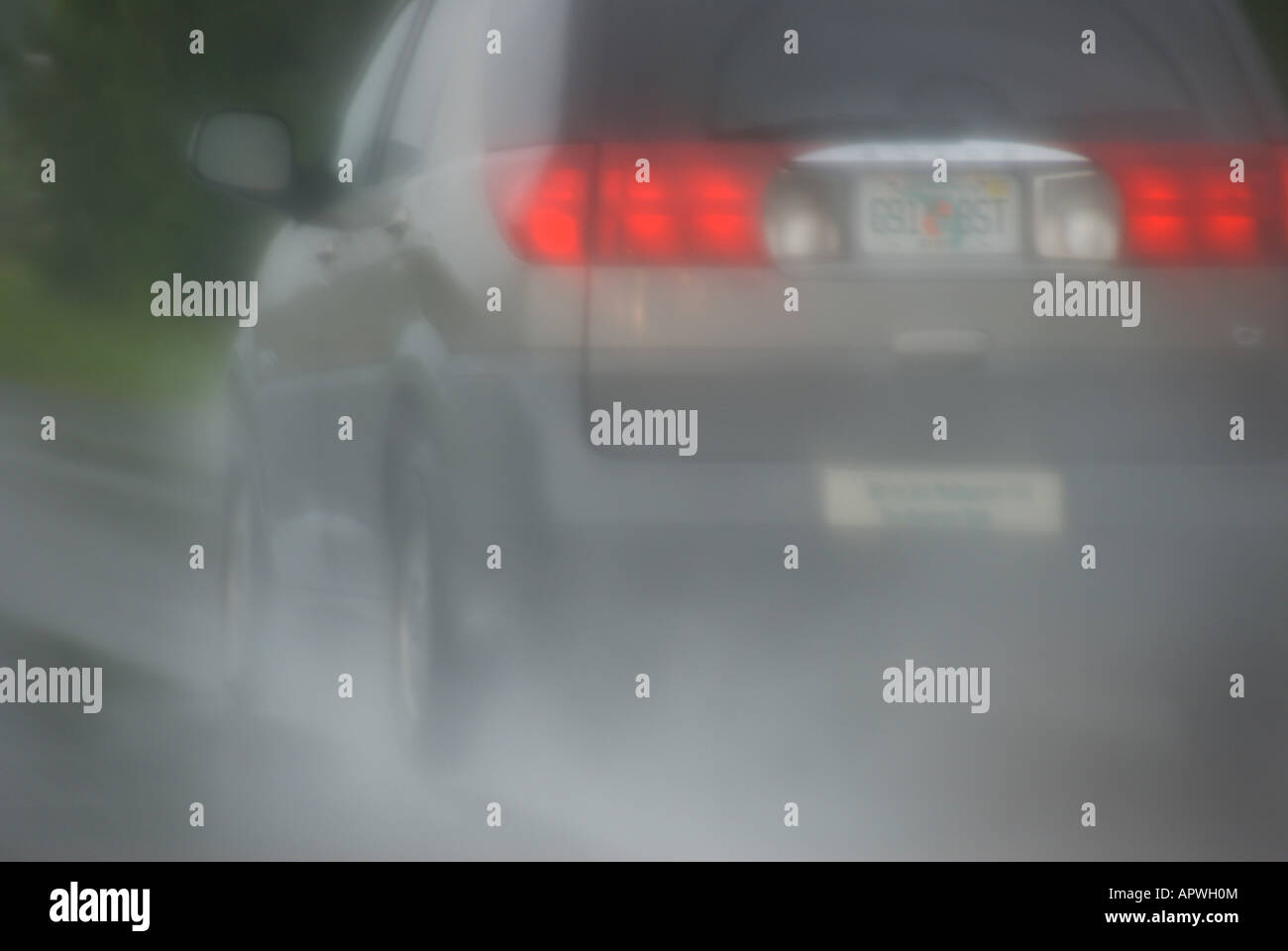 Bad weather rain and spray on highway dangerous driving conditions