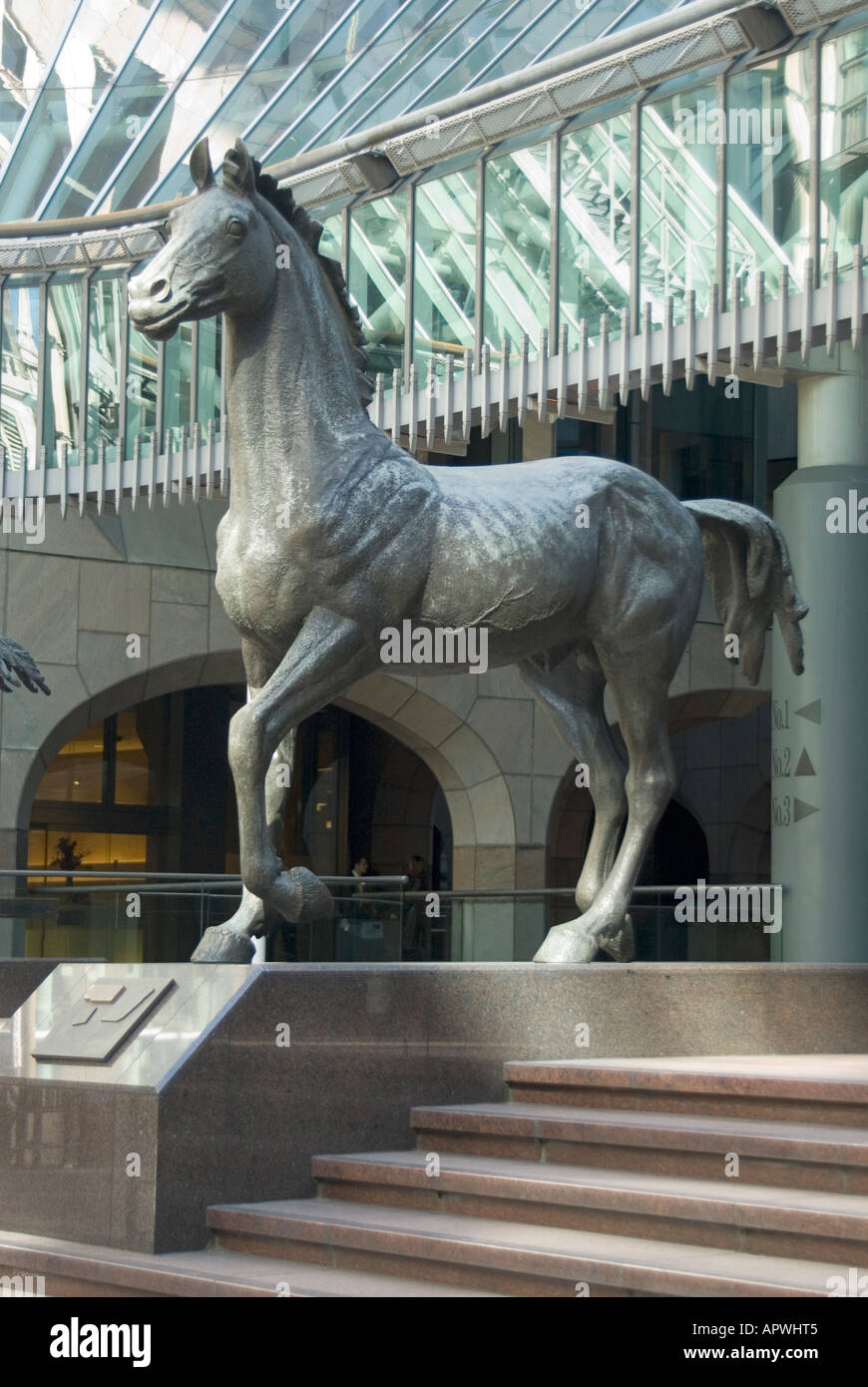One of three horse equestrian sculpture statues by Althea Wynne at forecourt entrance to Minster Court office complex Mincing Lane City of London UK Stock Photo