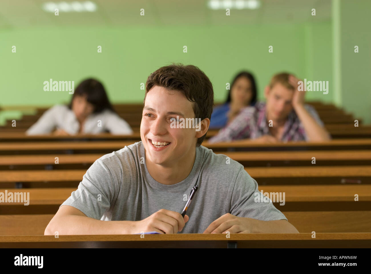 portrait of smiling male student in lecture hall Stock Photo - Alamy