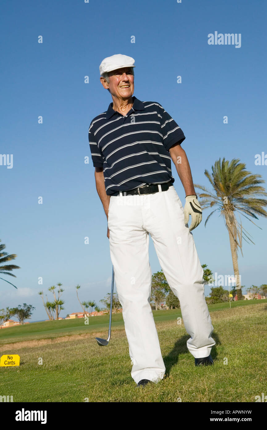 portrait of mature golf player wearing flat cap Stock Photo Alamy