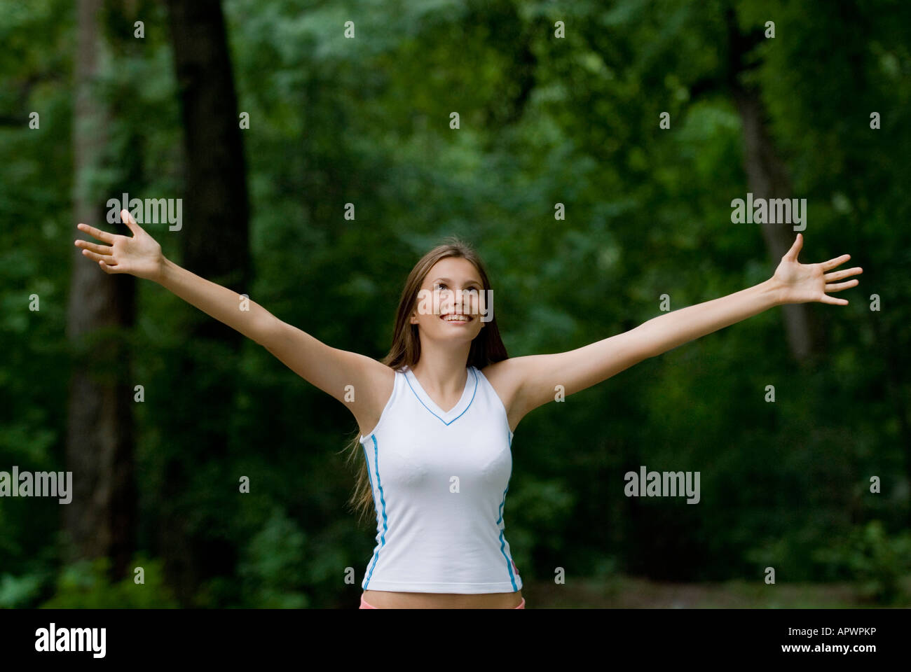 portrait of happy young woman in park Stock Photo - Alamy
