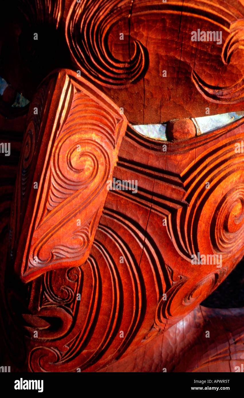Traditional Maori carving showing face of a warrior, Rotorua, New Zealand Stock Photo