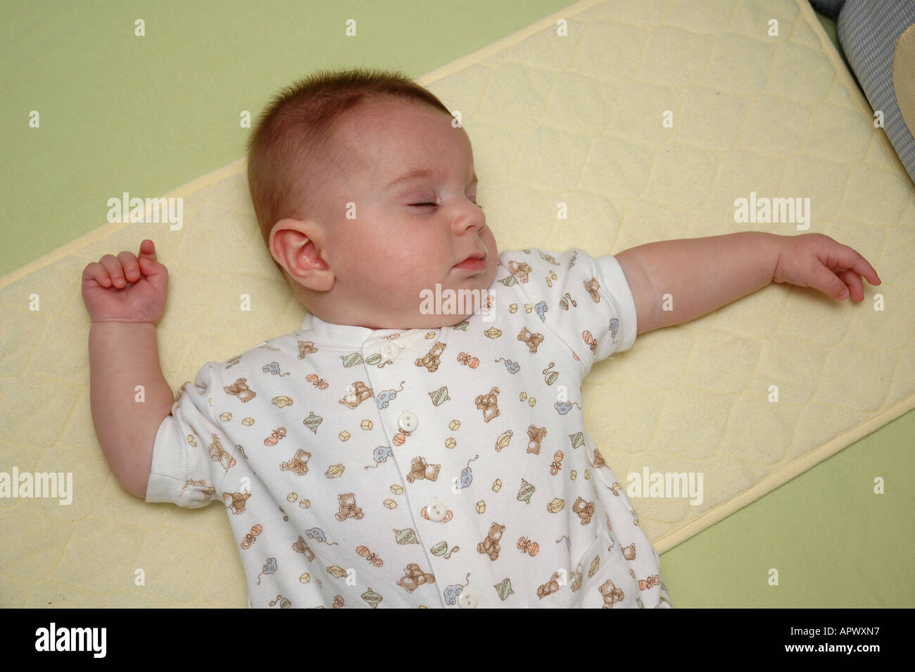 Fourmonthold male baby exhibits classic ATNR positioning while