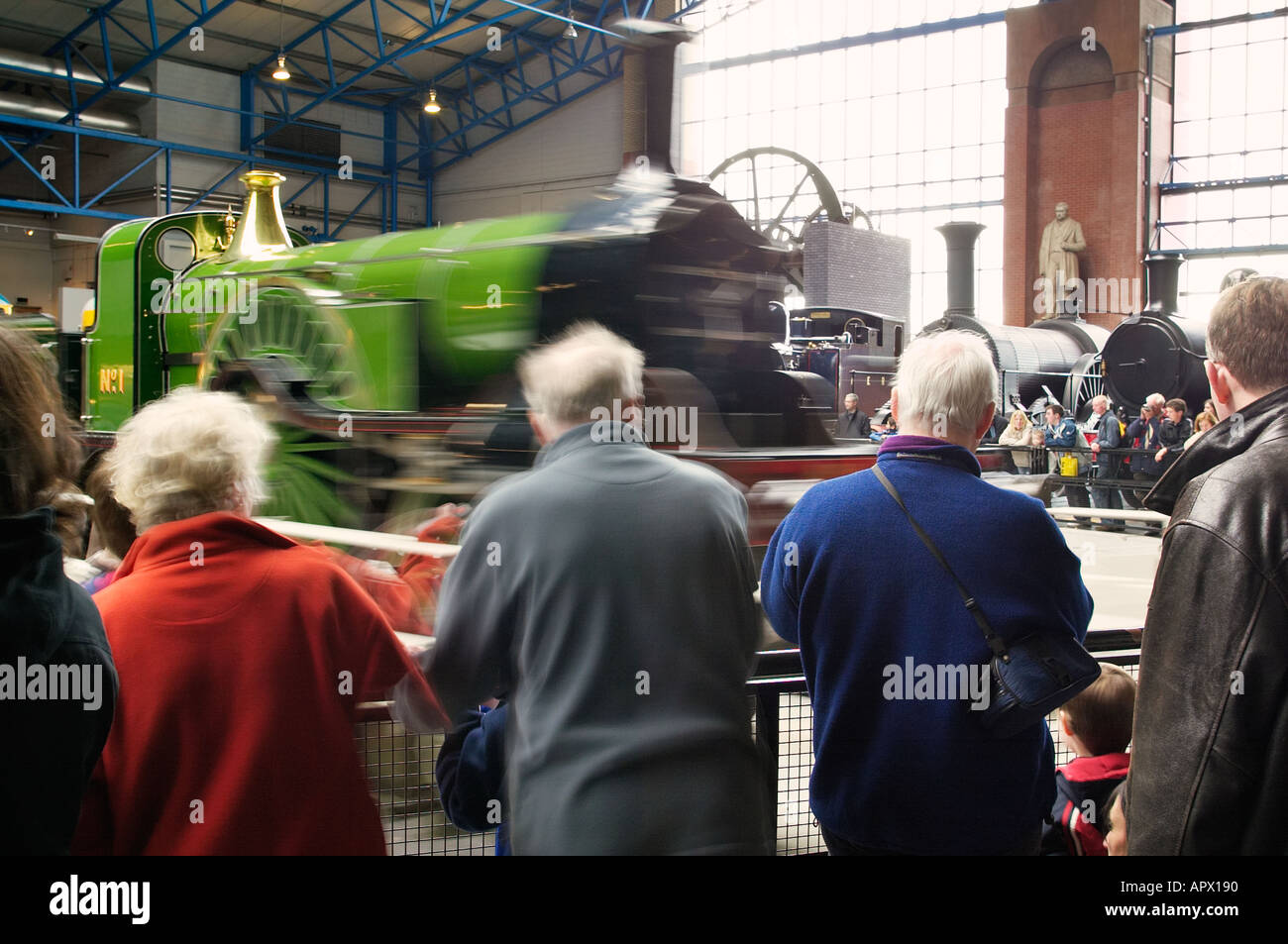 Stirling Single No1 locomotive on the turntable at the National Railway Museum York watched by visitors Stock Photo
