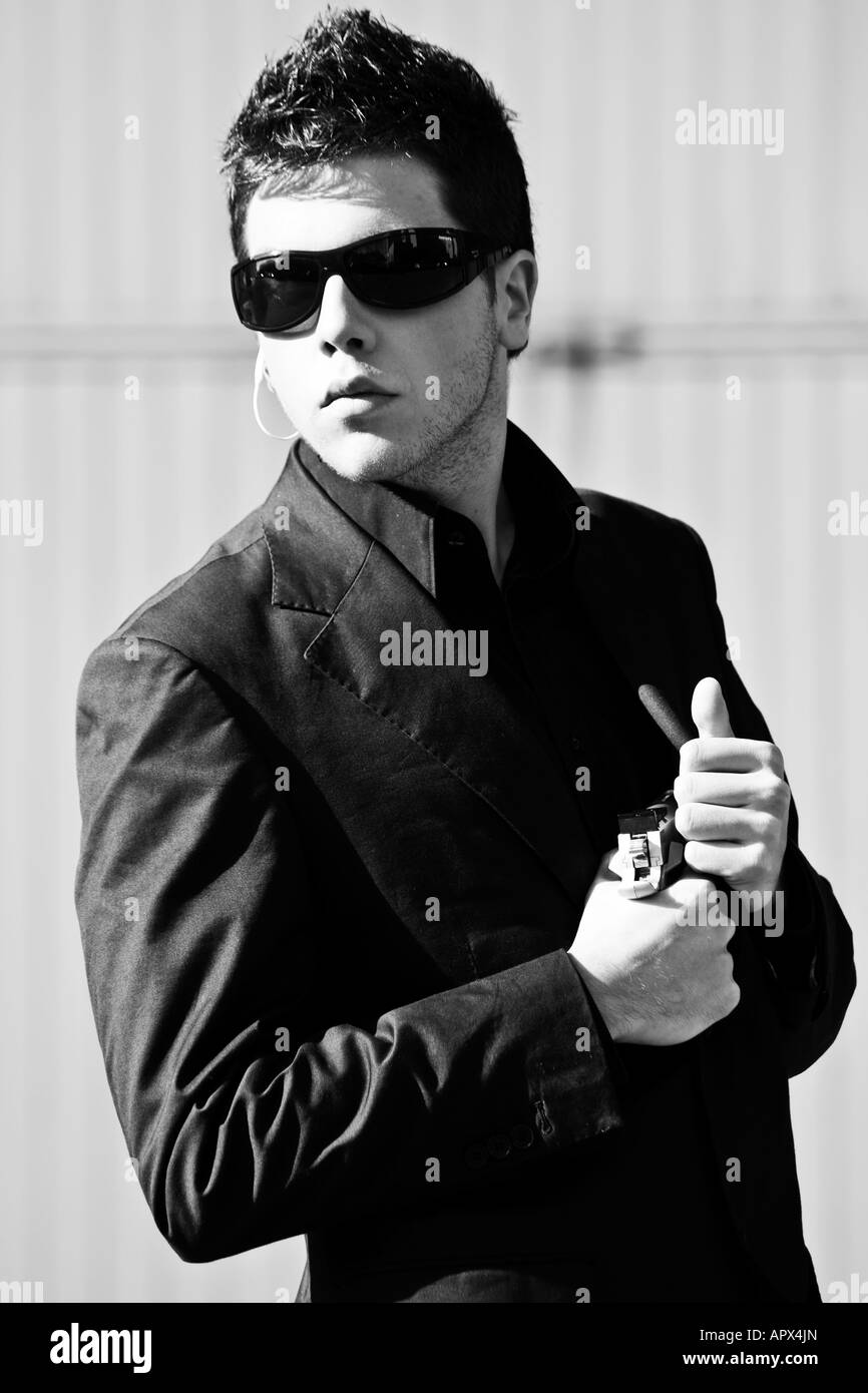 Alertness secret agent ready for action in black and white Stock Photo