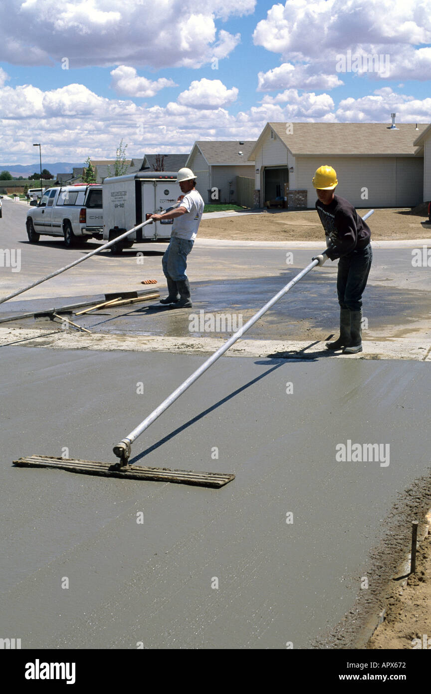 Workers floating a concrete slab Stock Photo Alamy