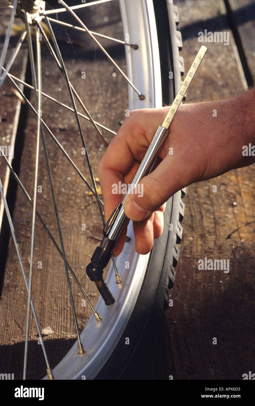 Air pressure gauge being used on a bicycle tire Stock Photo Alamy