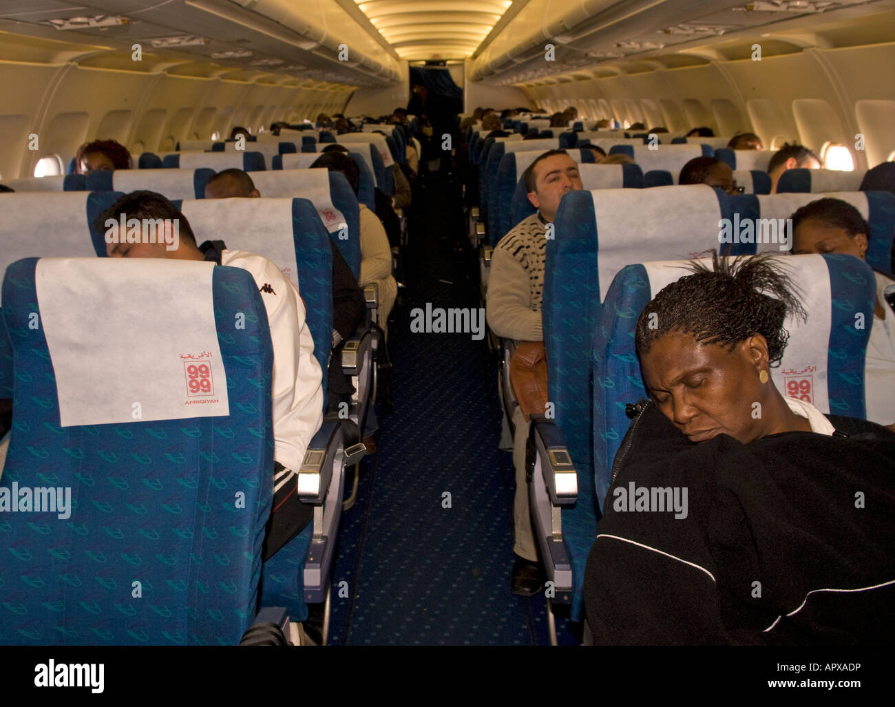 Passengers on an Afriqiyah Airways flight from Tripoli Libya to London Gatwick on 12th January 2008 Stock Photo