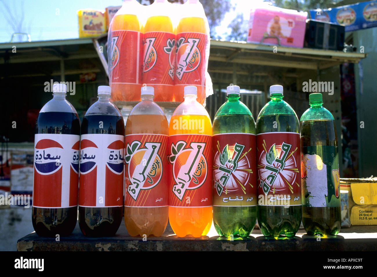 Brightly coloured soft drinks and cola for sale Stock Photo Alamy