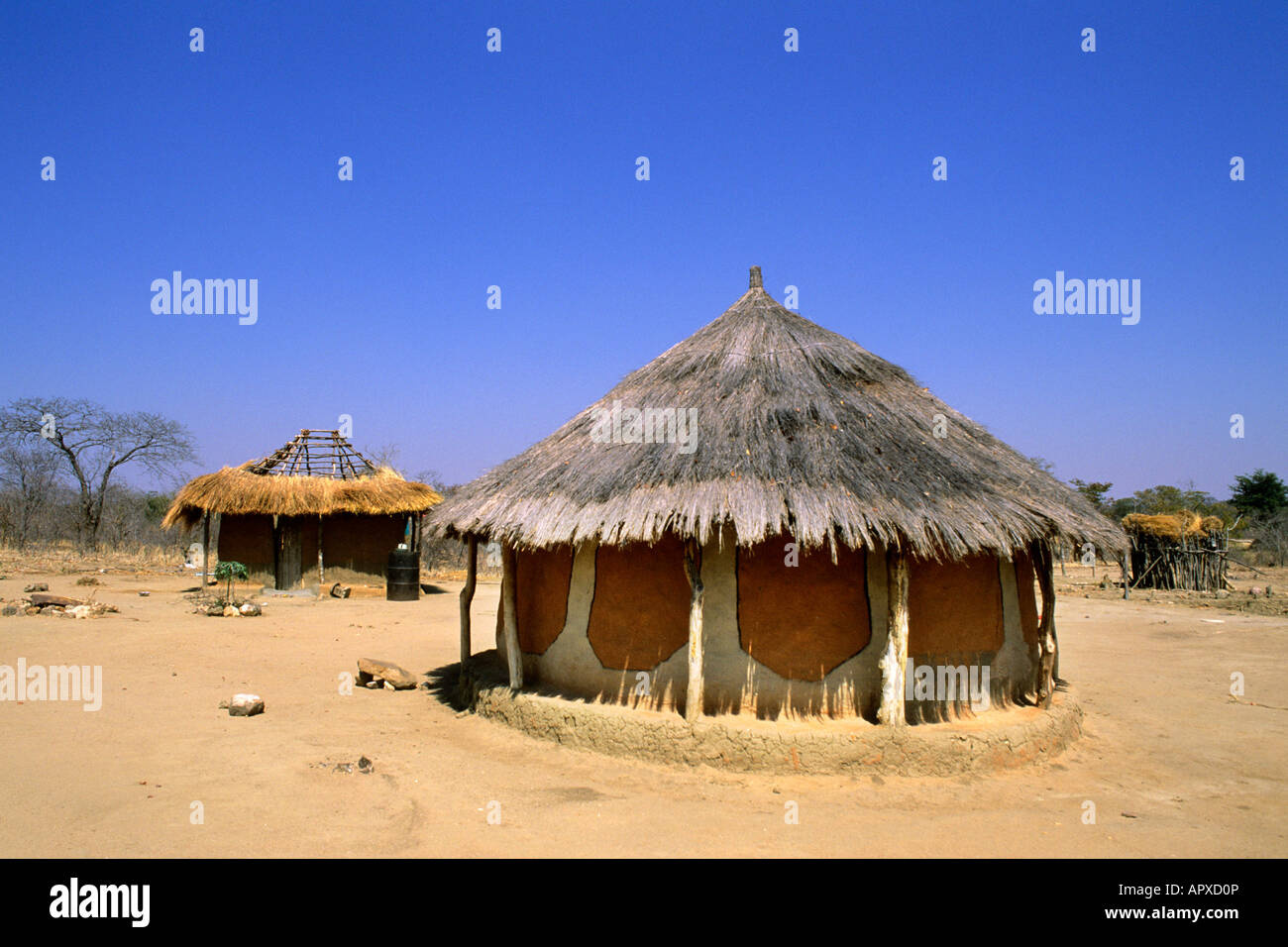 Traditional mud and thatched hut in Zimbabwe Stock Photo