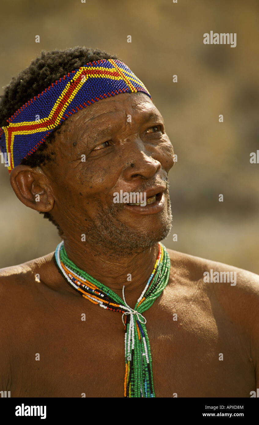A portrait of a Bushman wearing a beaded headband and neck adornment Stock Photo